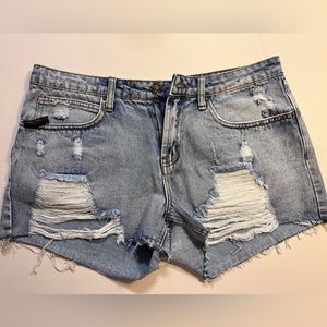 Mid Rise Ripped Hem Denim Shorts